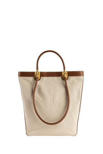 Premium designer bag in rich caramel brown, crafted with refined craftsmanship and high-quality materials, features a sleek silhouette and refined details, ideal for organizing essentials in style.