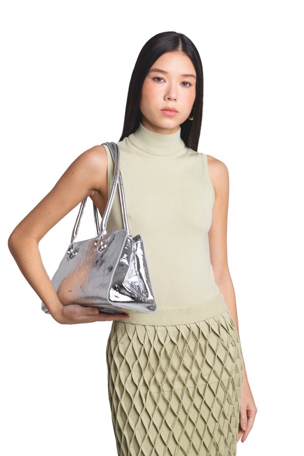 Sophisticated crossbody bag with adjustable strap, featured in a compact structured silhouette with premium zipper closure, features a sleek silhouette and refined details, ideal for organizing essentials in style.
